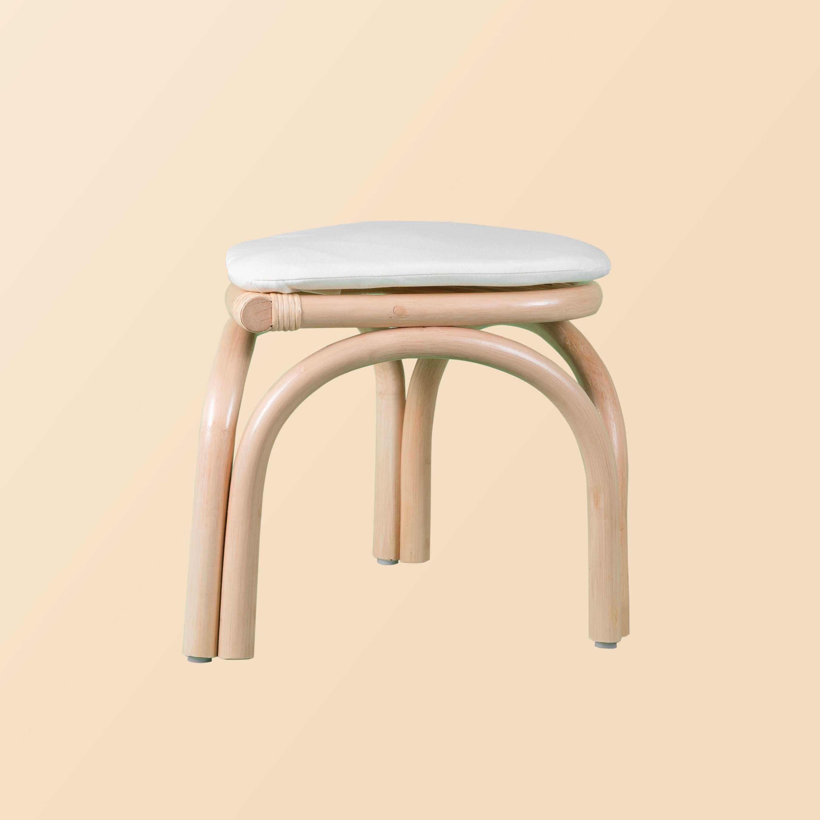 Side view of the Aulia Kids Stool by MOMIJI, highlighting its compact shape and woven structure.