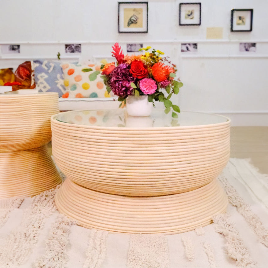 Front view of the Charme Coffee Table by MOMIJI styled with a vase and matching side table nearby.