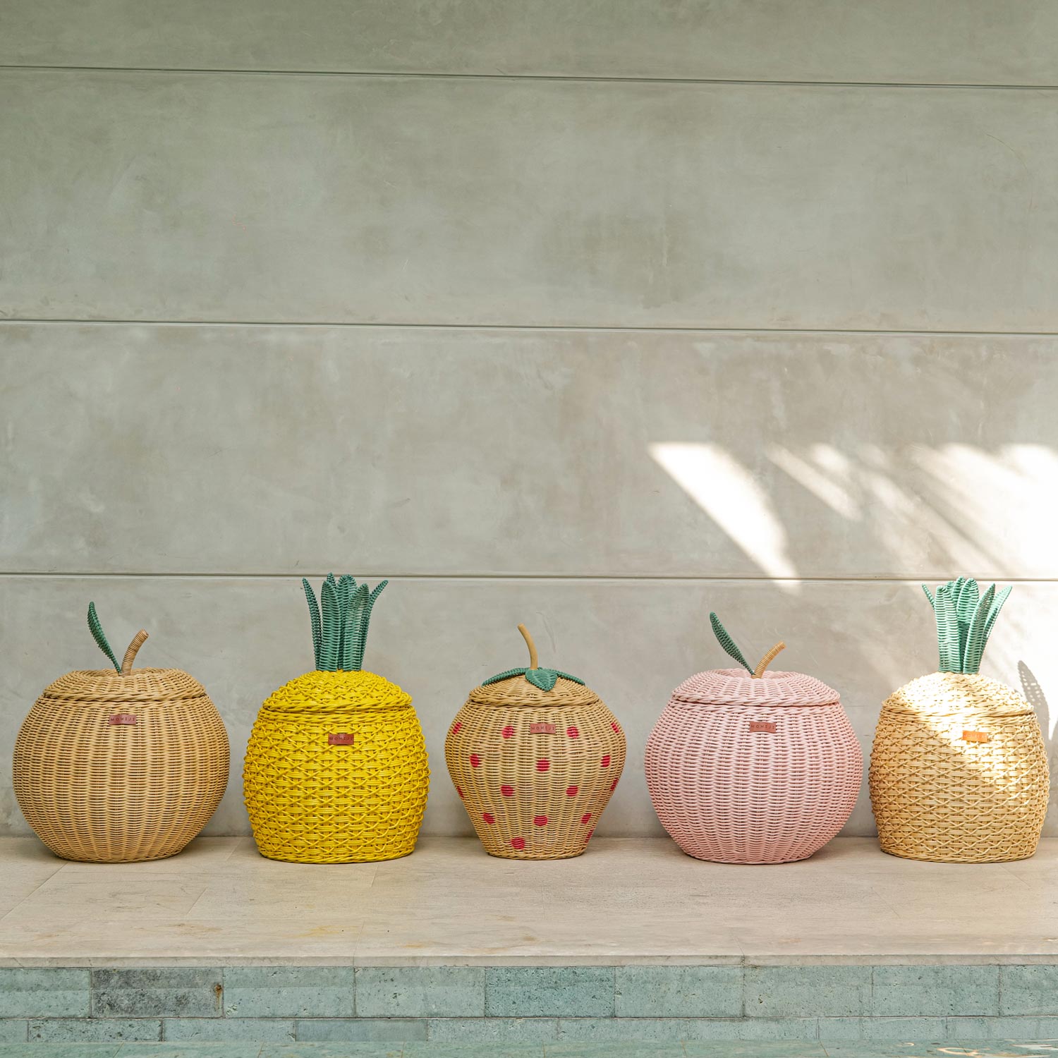 Fruit designed rattan storage basket by MOMIJI collection lined up.