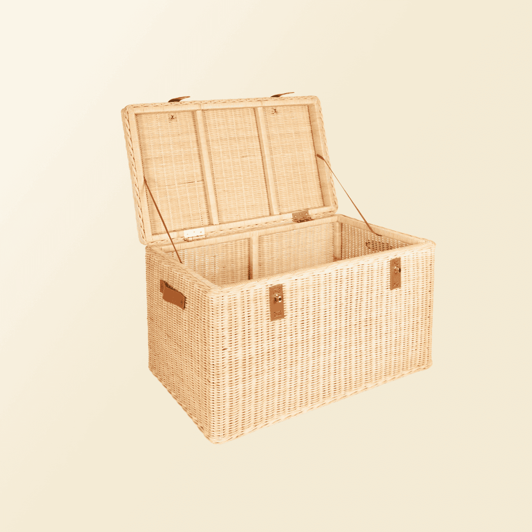Angled open view of the handcrafted rattan wicker Leon Leather Trunk by MOMIJI, showing spacious interior and safety support straps.