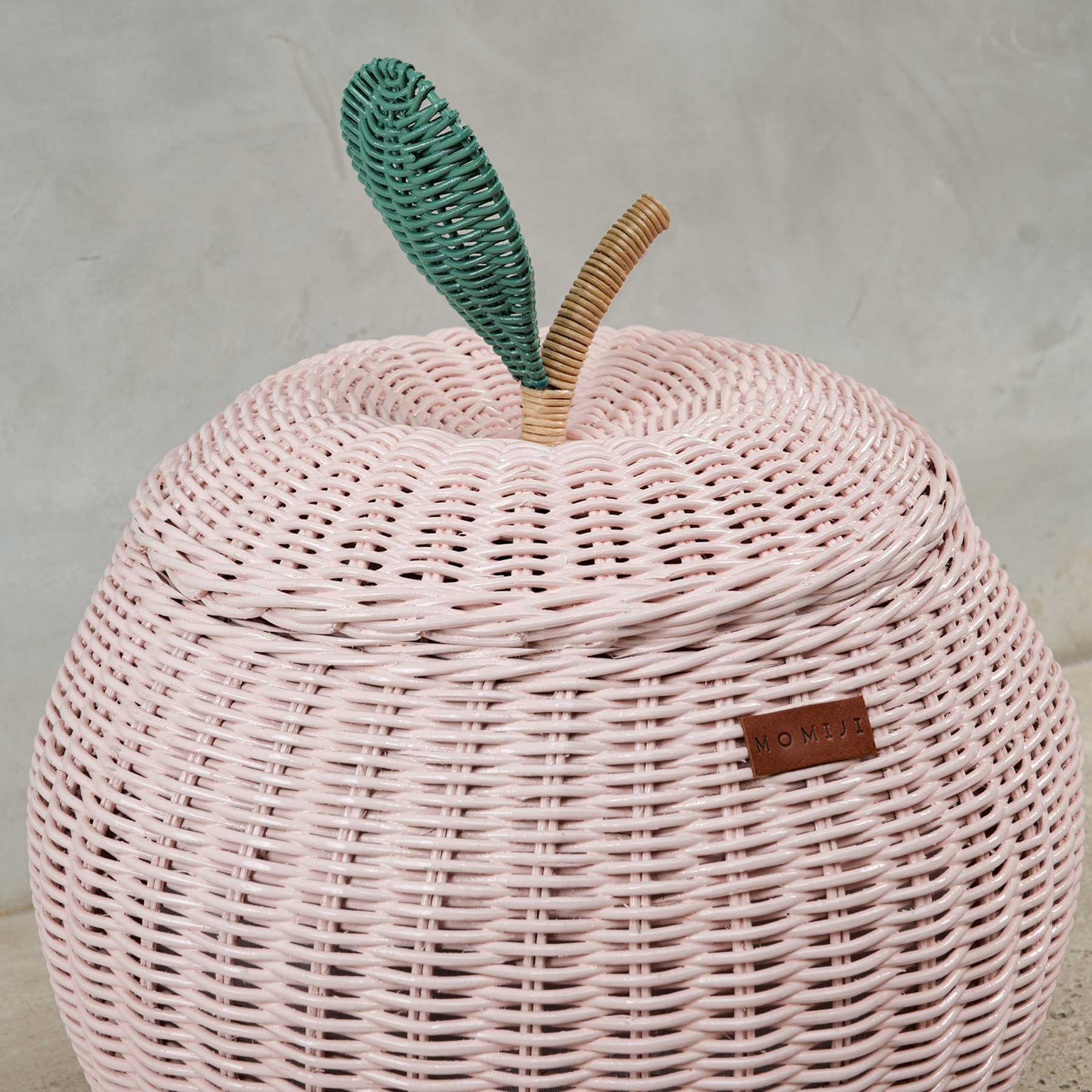 Close up view of pink apple rattan storage basket lid by MOMIJI in medium size.