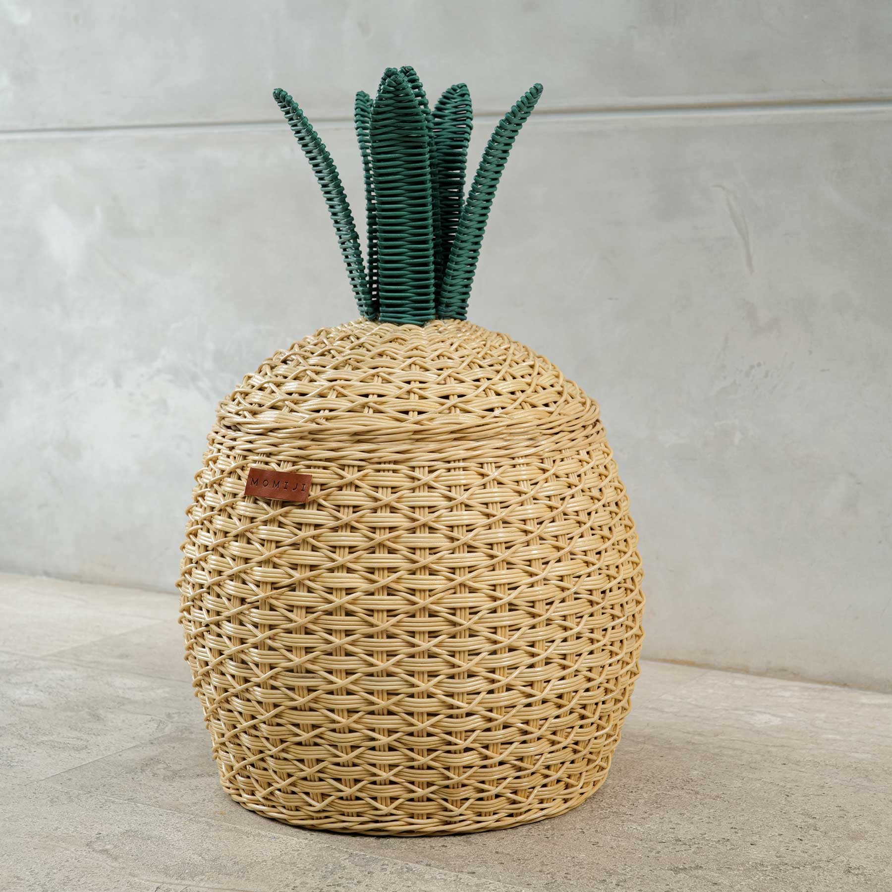 Tilted side view of Pineapple Rattan Storage Basket by MOMIJI