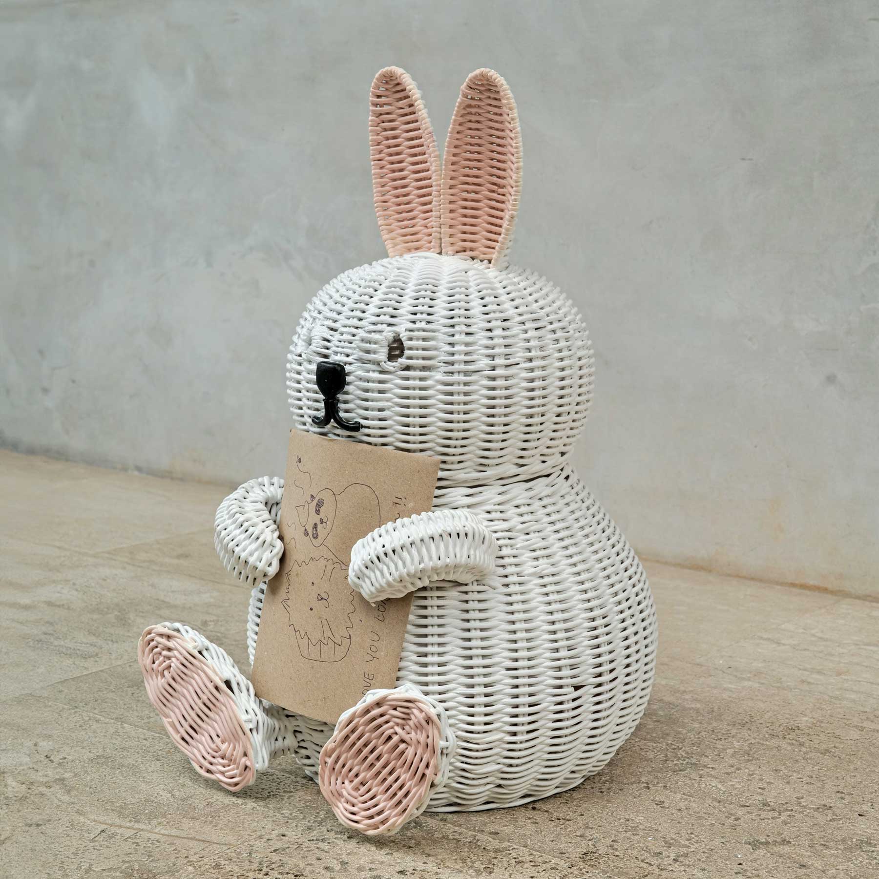 Bunny Rattan Storage Basket by MOMIJI holding a card on a neutral background.