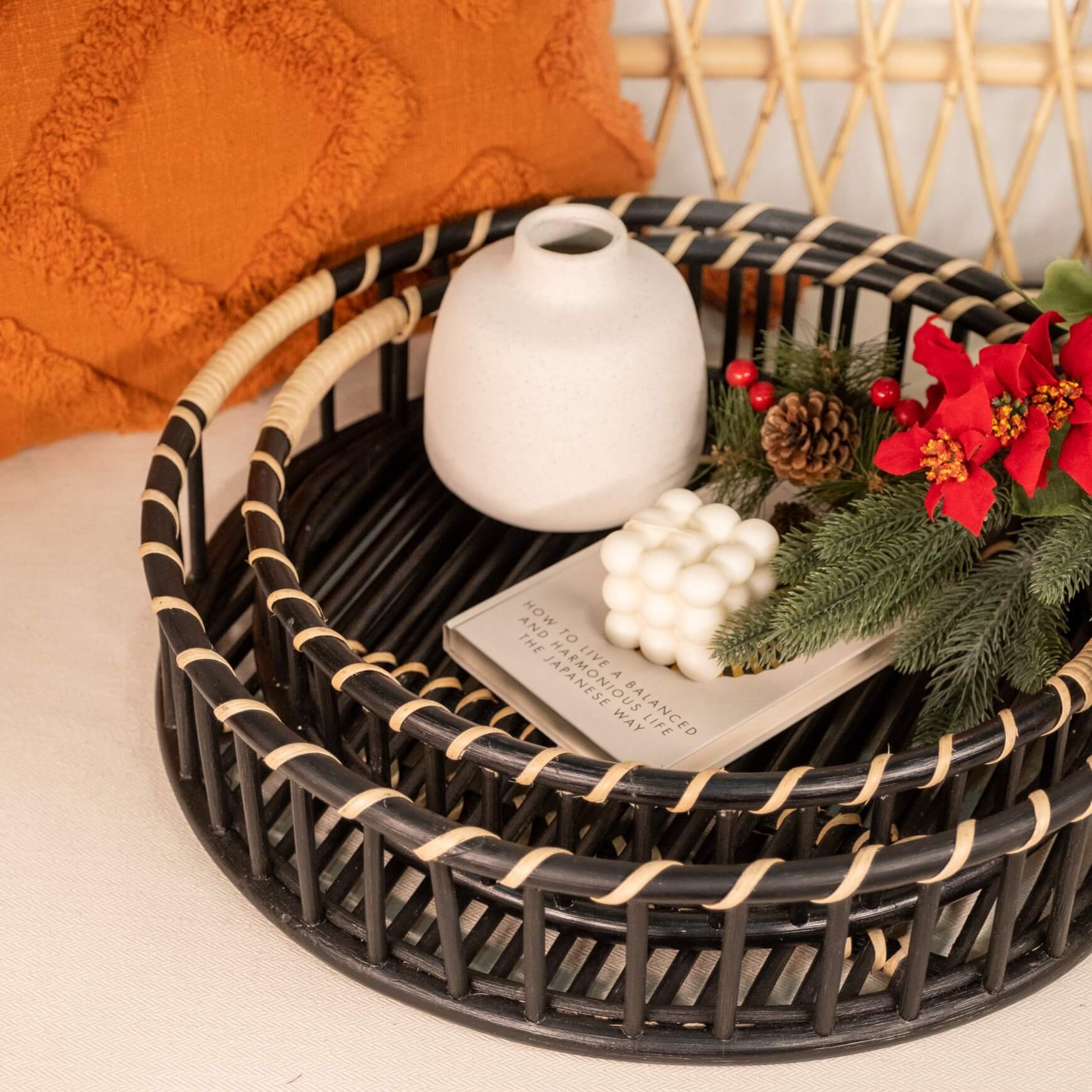 Maru Tray Set by MOMIJI styled with decorative objects on a table.