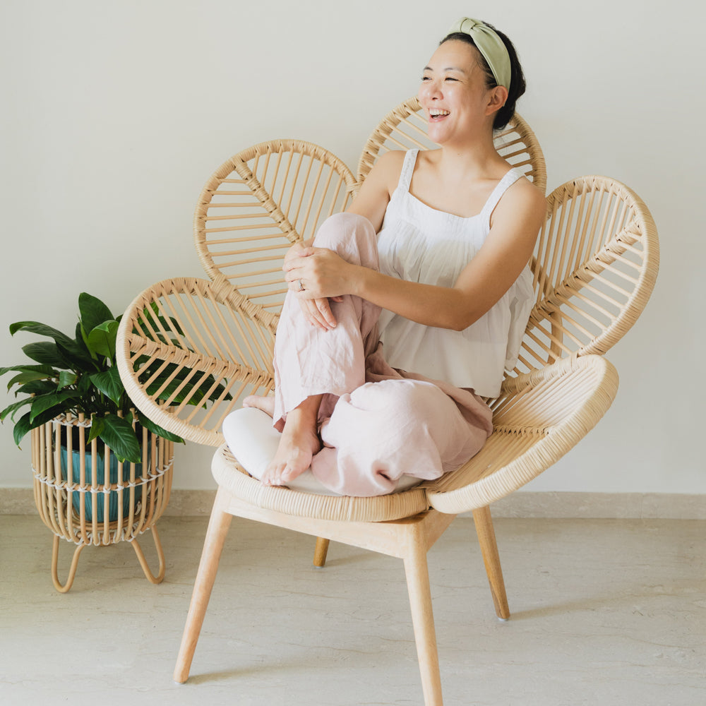 Rattan Chairs | Petal Chair | Woman Sitting on Wicker Chair | MOMIJI