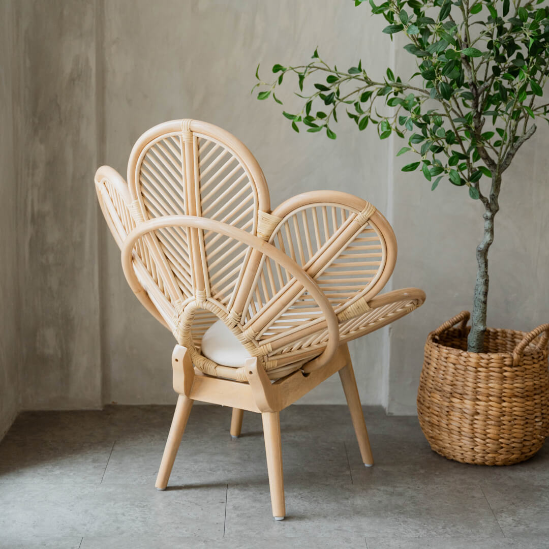 Back view of the Petal Kids Chair by MOMIJI in a room with plants, showing the reinforced backrest support for added strength.