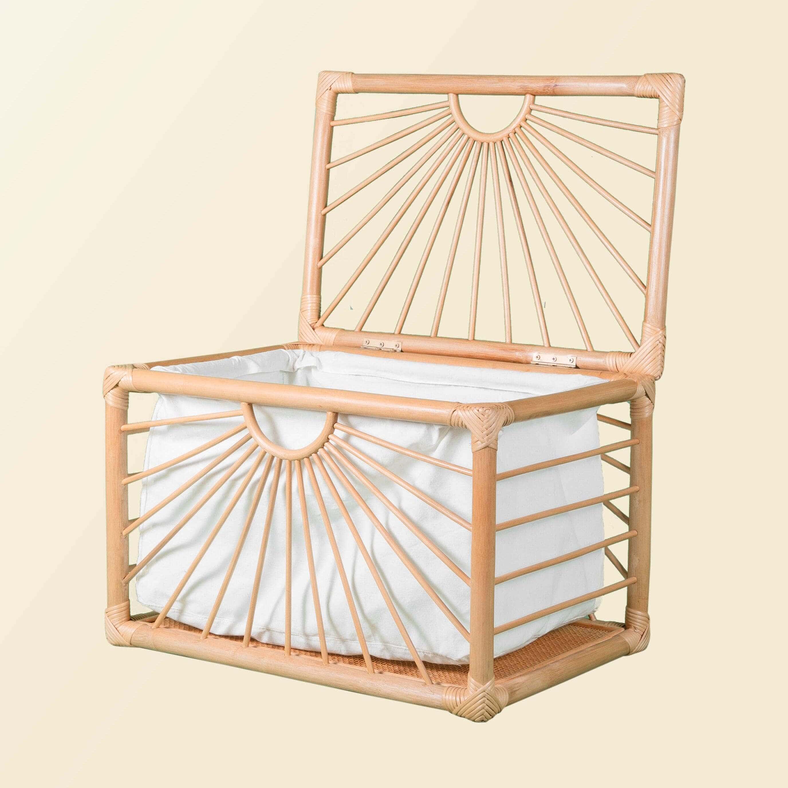 Angled view of the handcrafted wicker Xander Trunk by MOMIJI with the lid open, showing its storage compartment.