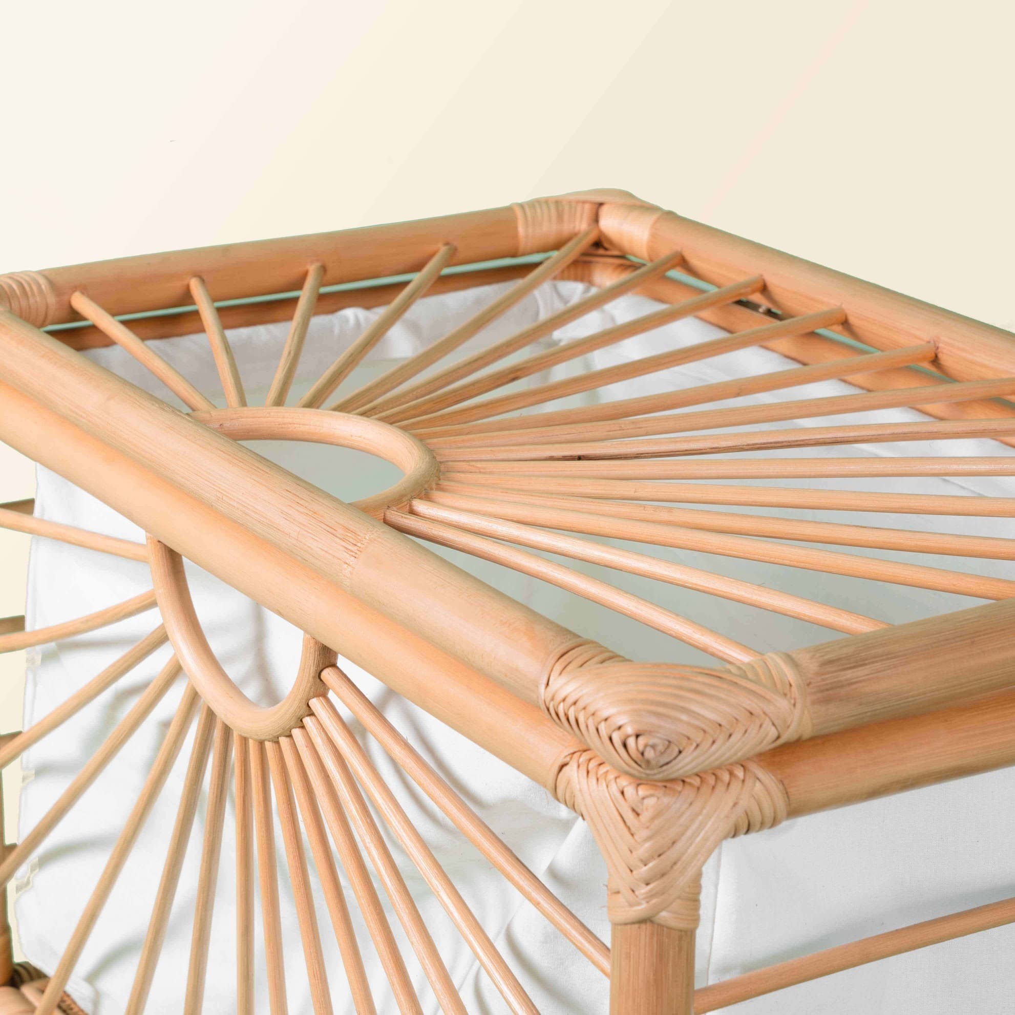 Close-up of the angled side detail of the handcrafted rattan Xander Trunk by MOMIJI.