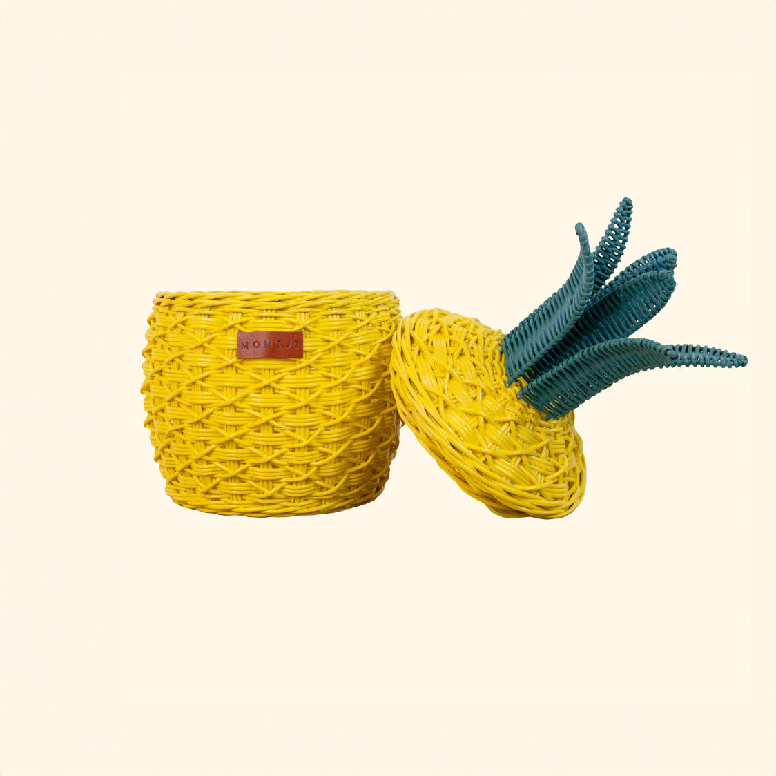 Front view of a handcrafted yellow pineapple rattan storage basket in small size by MOMIJI with the lid open, highlighting its compact storage space.