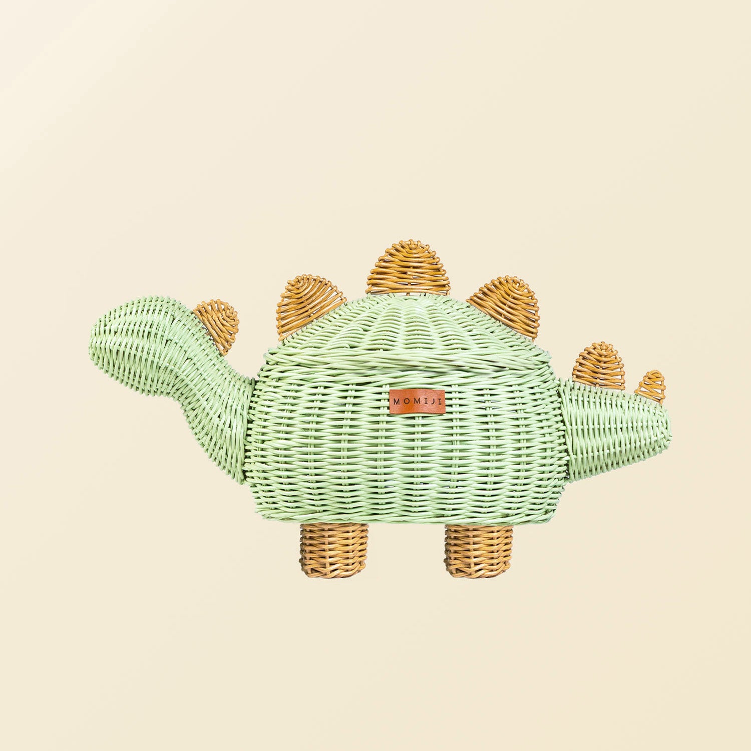 Side view of the medium size handcrafted dinosaur storage basket by MOMIJI in mint green rattan, featuring natural rattan spine and leg details.