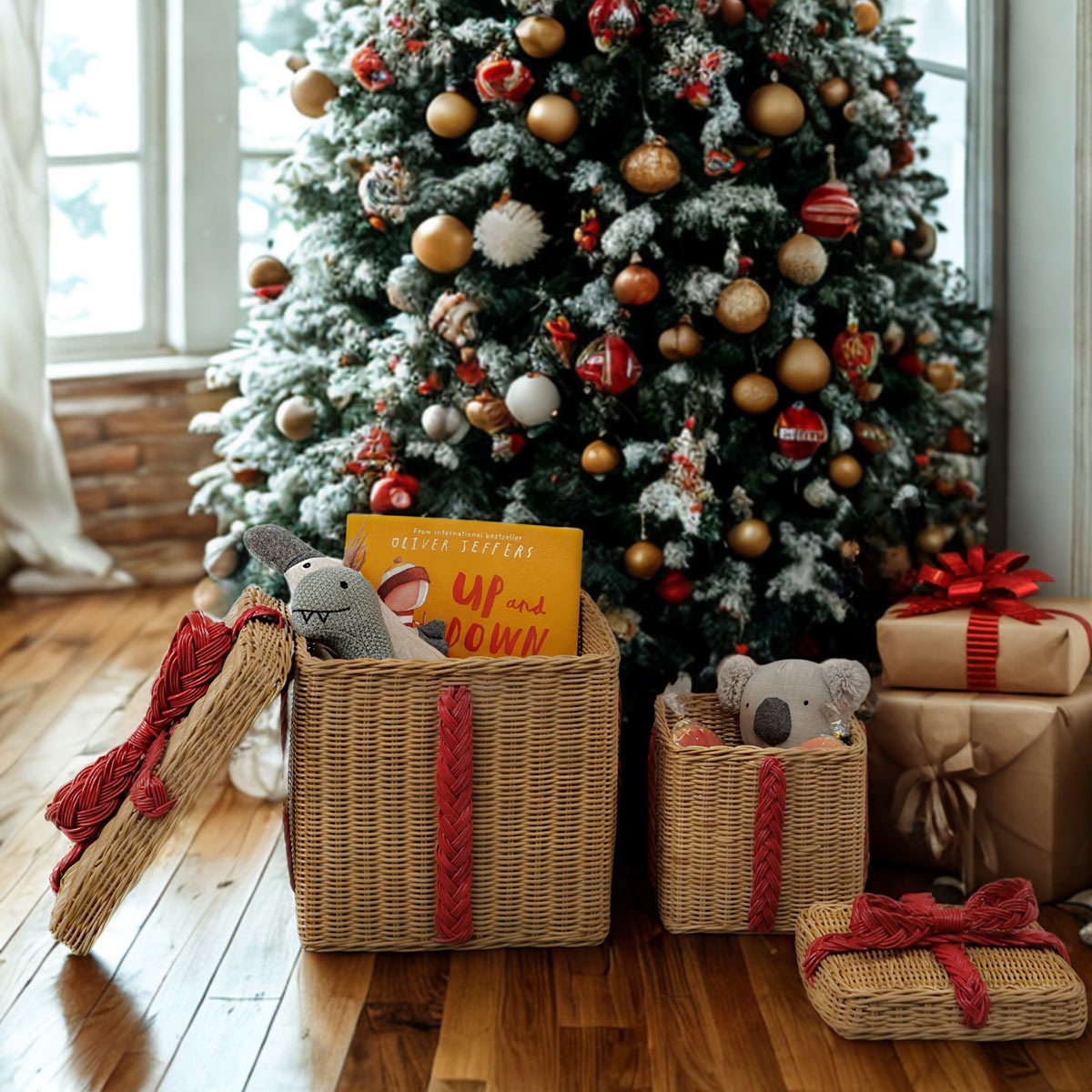 Handcrafted rattan wicker storage gift boxes by MOMIJI filled with kid's toys displayed open in a festive room with a decorated Christmas tree and presents.