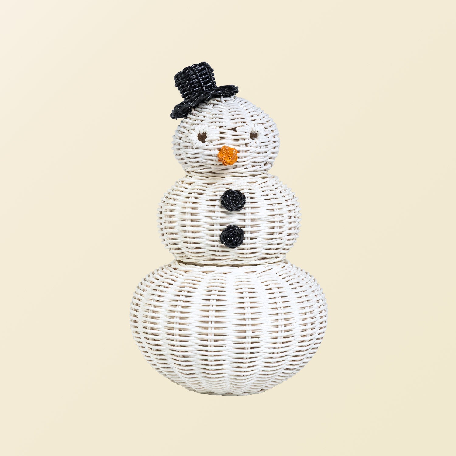 Handcrafted rattan wicker snowman basket by MOMIJI with a white color, featuring round eyes, carrot nose detail, black top hat, and round button accents on a beige background.