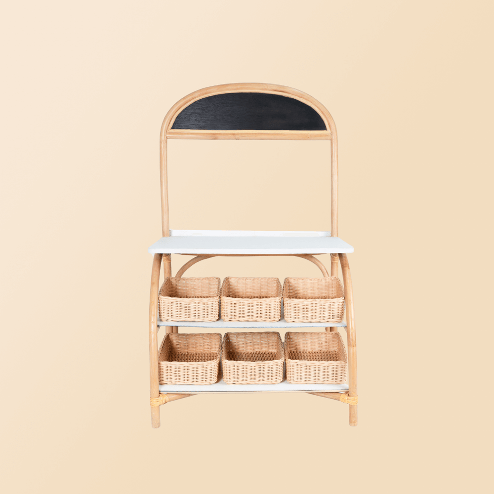 Front view of the 3-in-1 furniture by MOMIJI in grocery store mode with a rattan basket.