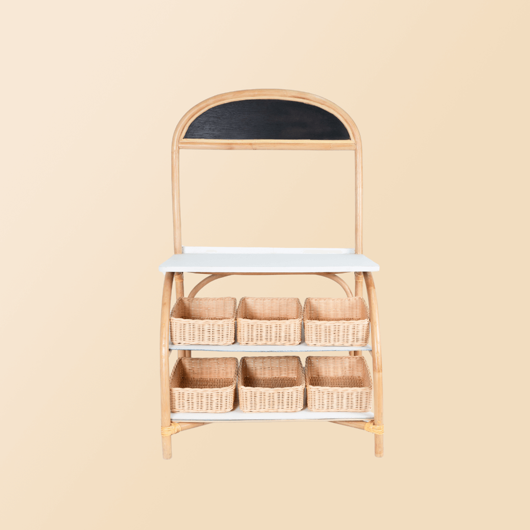 Front view of the 3-in-1 furniture by MOMIJI in grocery store mode with a rattan basket.