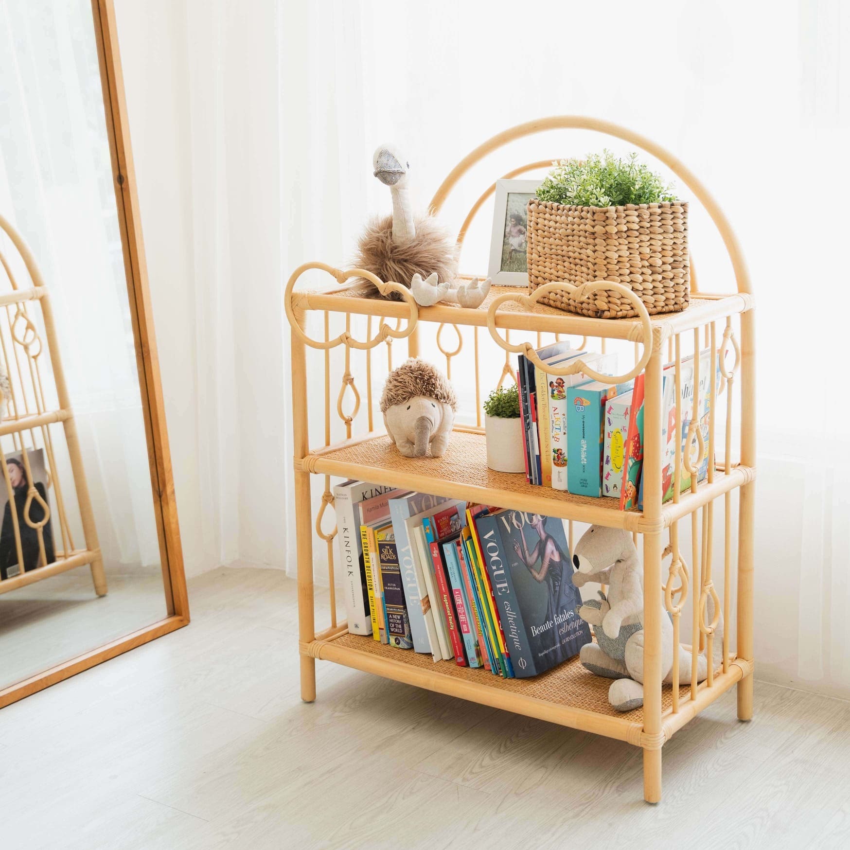
Wooden After the Rain Shelf by MOMIJI styled with books, plants, and decorative items in a room with a mirror.