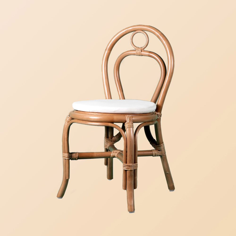Front view of the Amélie Kids Chair by MOMIJI with a white cushion.