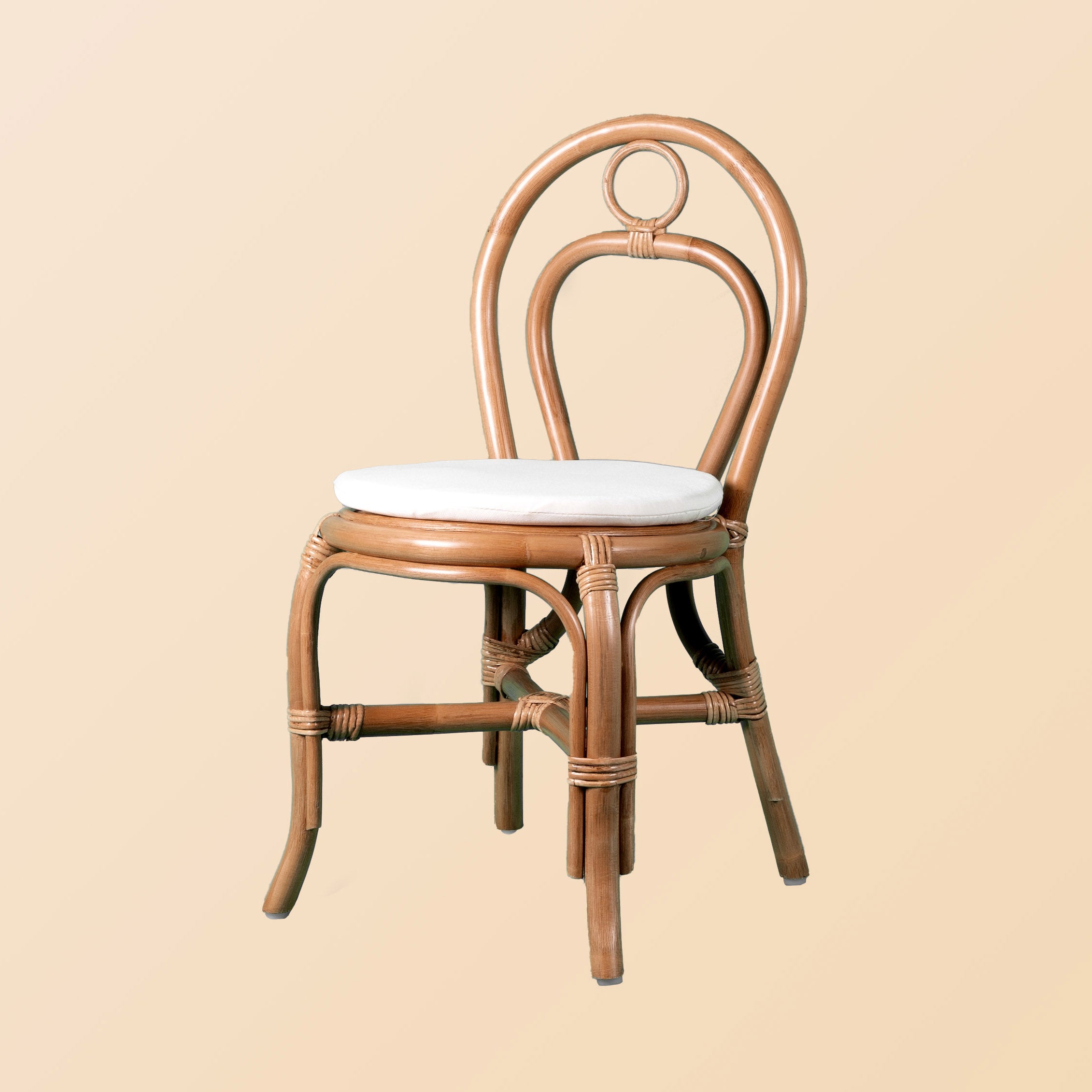 Front view of the Amélie Kids Chair by MOMIJI with a white cushion.