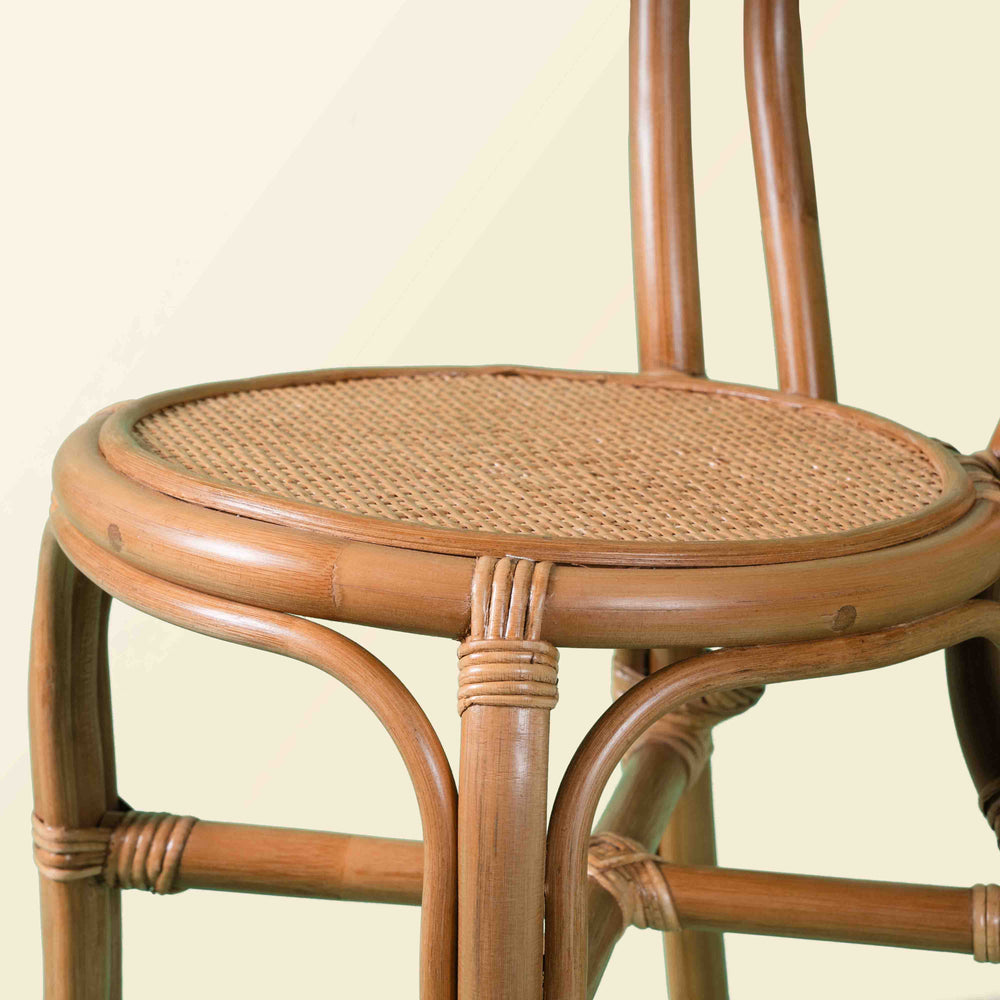 Close-up of the woven seat detail of the Amélie Kids Chair by MOMIJI without the cushion.