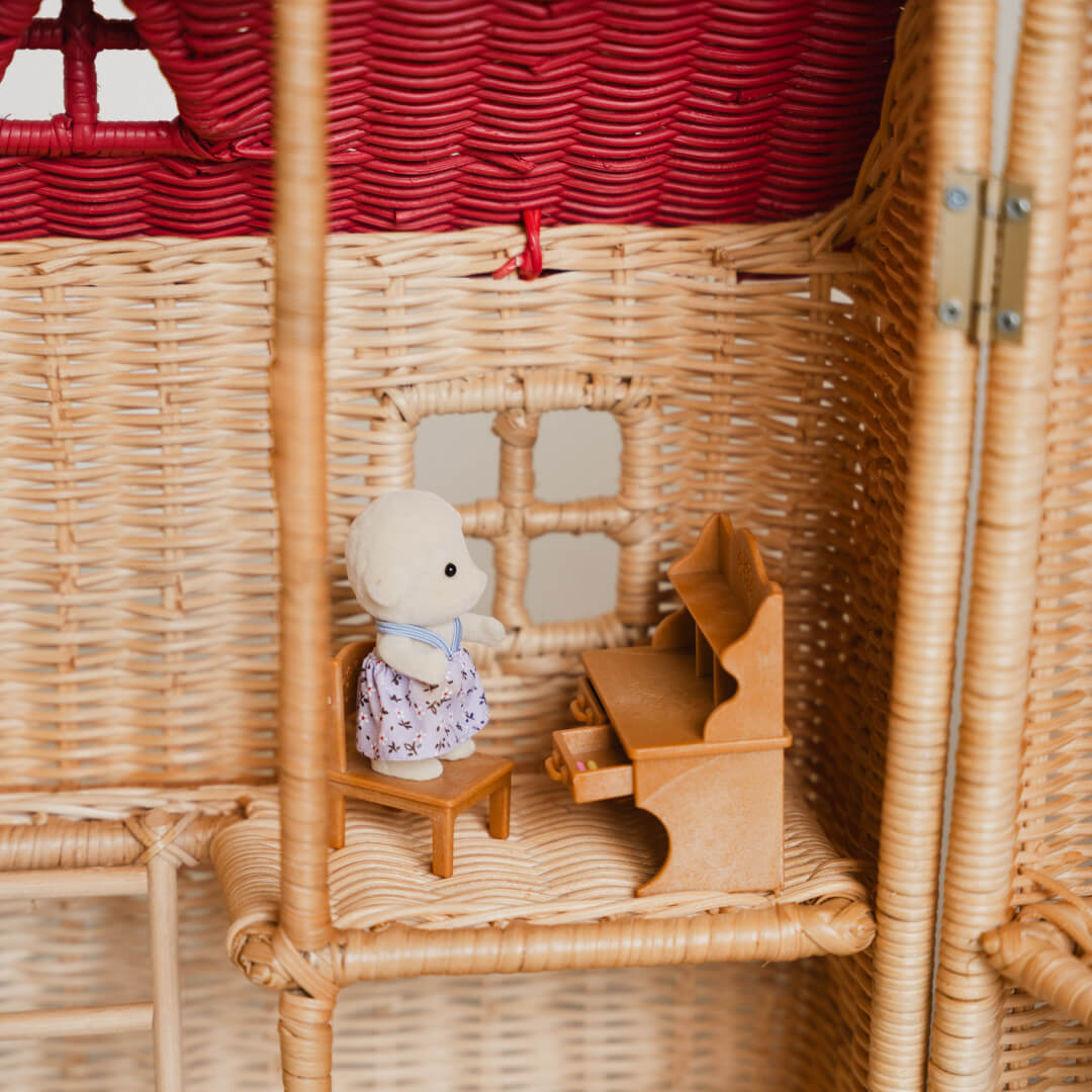 Close-up of the upper floor interior of the Amy Dollhouse Tote by MOMIJI, showing figurines with playset.