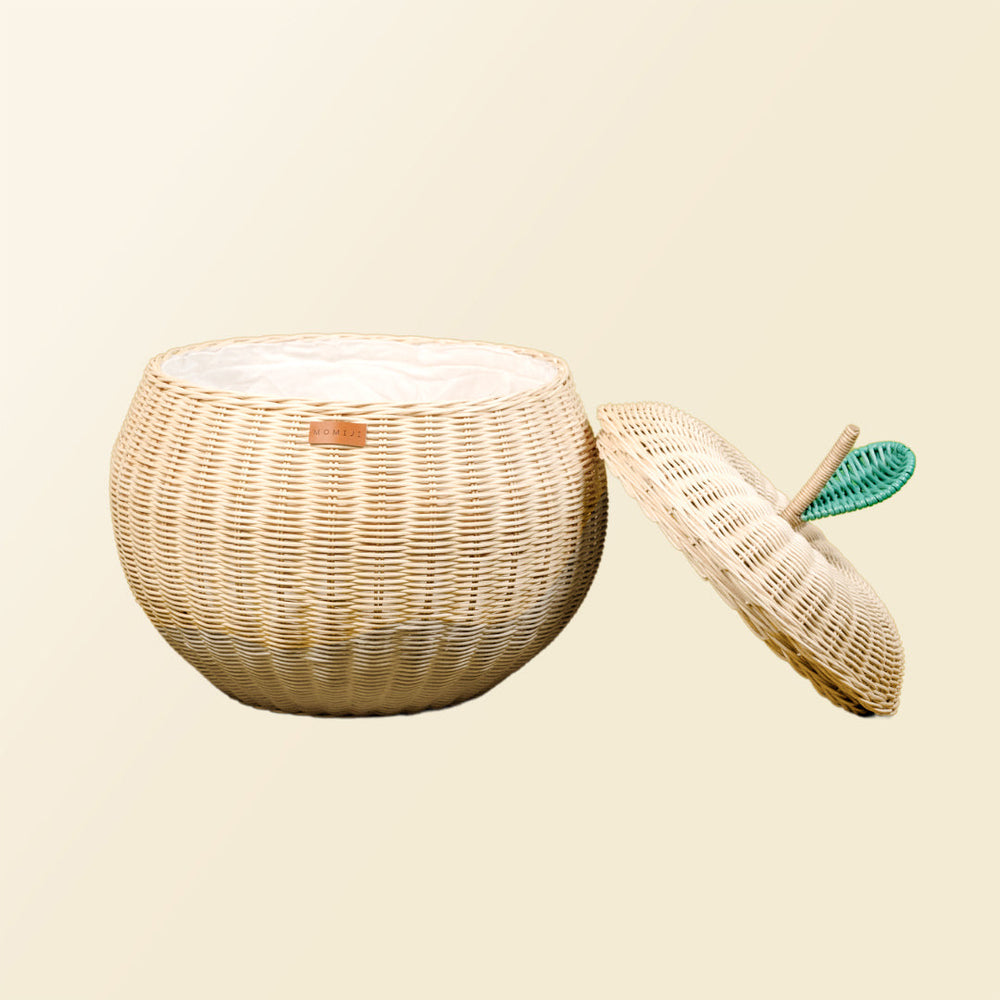 Front view of an opened natural apple rattan storage basket by MOMIJI, with lid leaning beside the rattan basket.