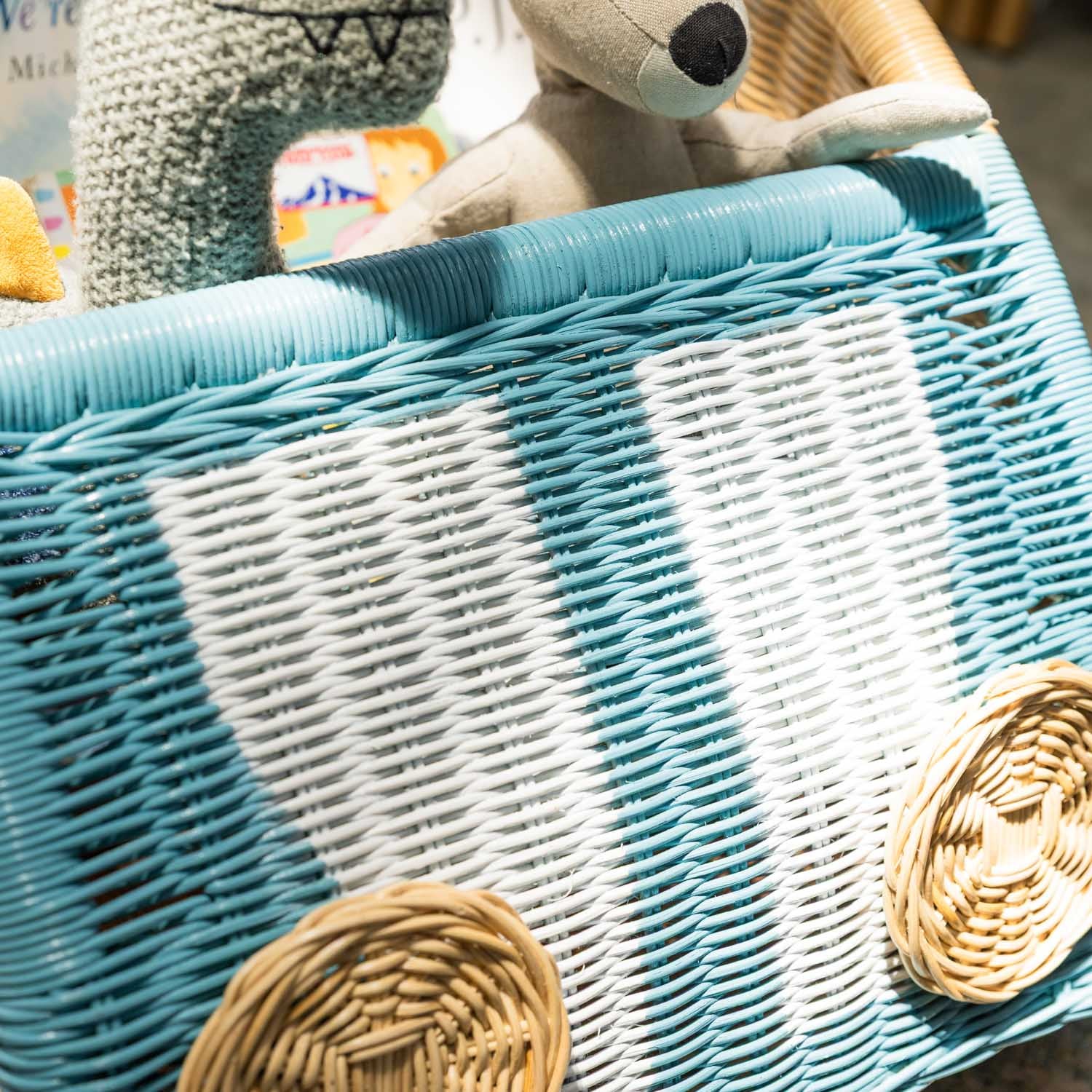 Close-up of the front area of the Archie Storage Wagon by MOMIJI filled with toys.