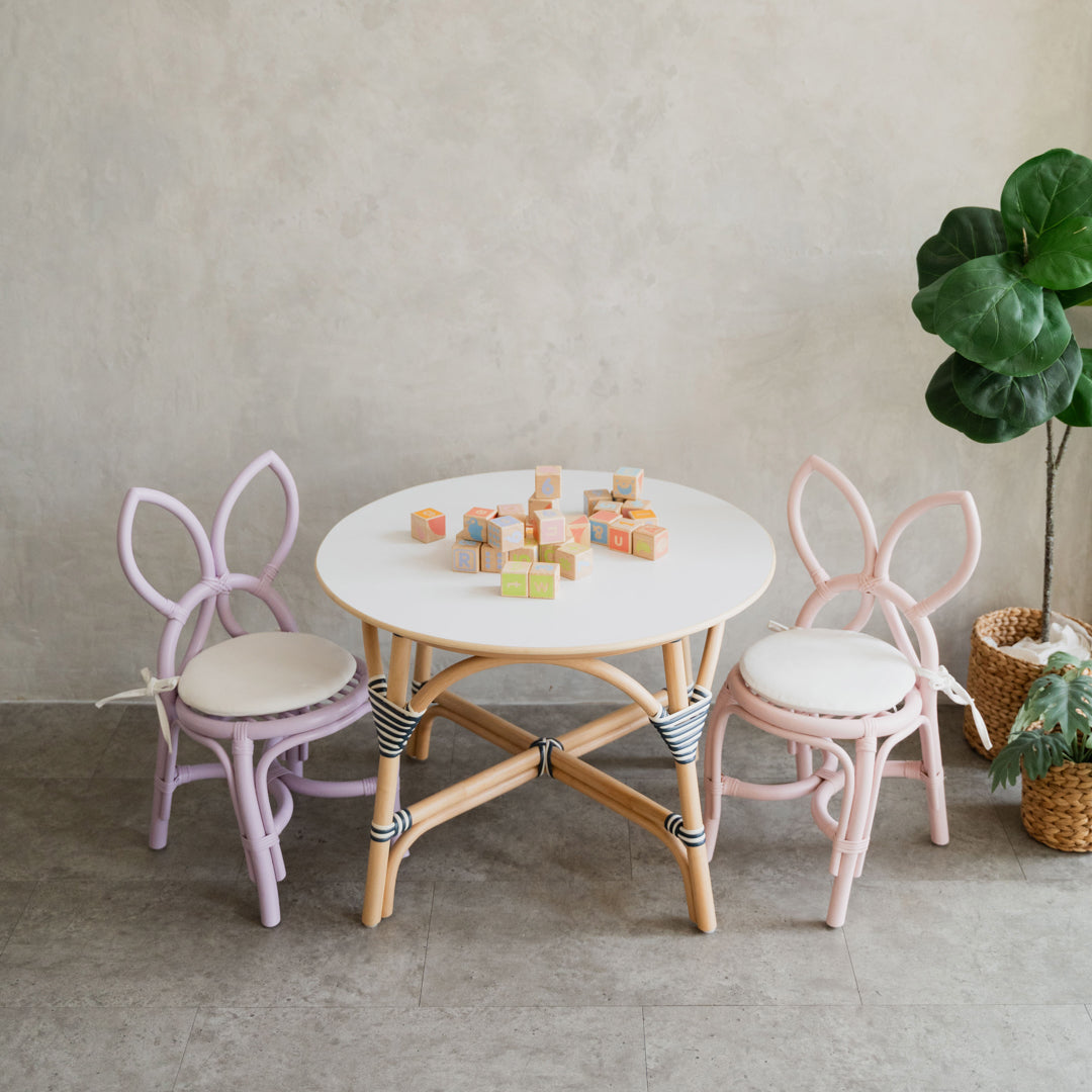 Pink and Purple Butterfly Kids Chairs by MOMIJI paired with an Aulia Kids Table, styled in a room with indoor plants and colourful building blocks on the table.