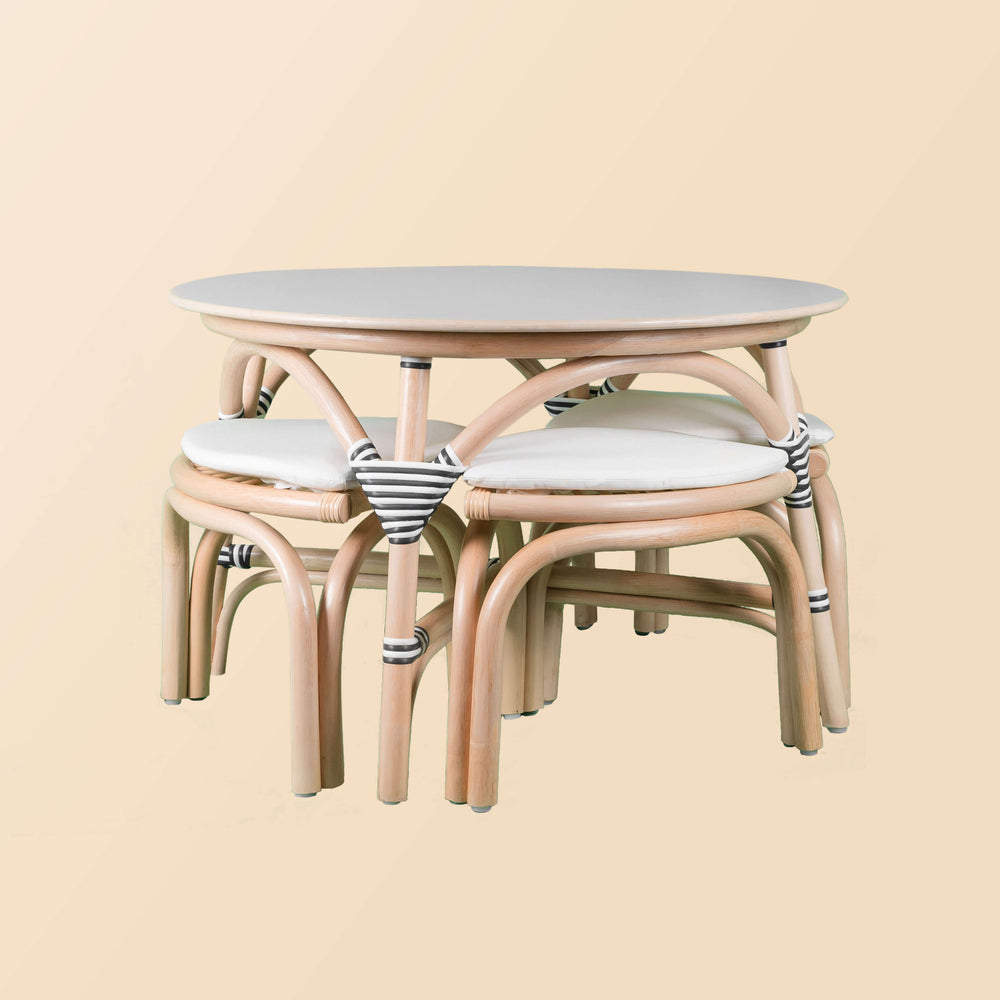 Front view of the Aulia Kids Table by MOMIJI with stools neatly stored underneath.