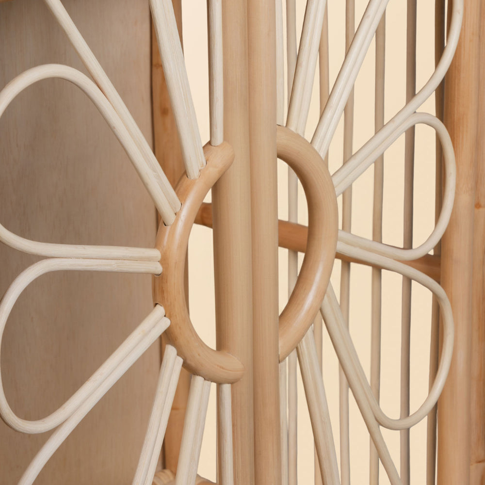Close-up of rattan flower integrated door handle detail on kids wardrobe cabinet rack
