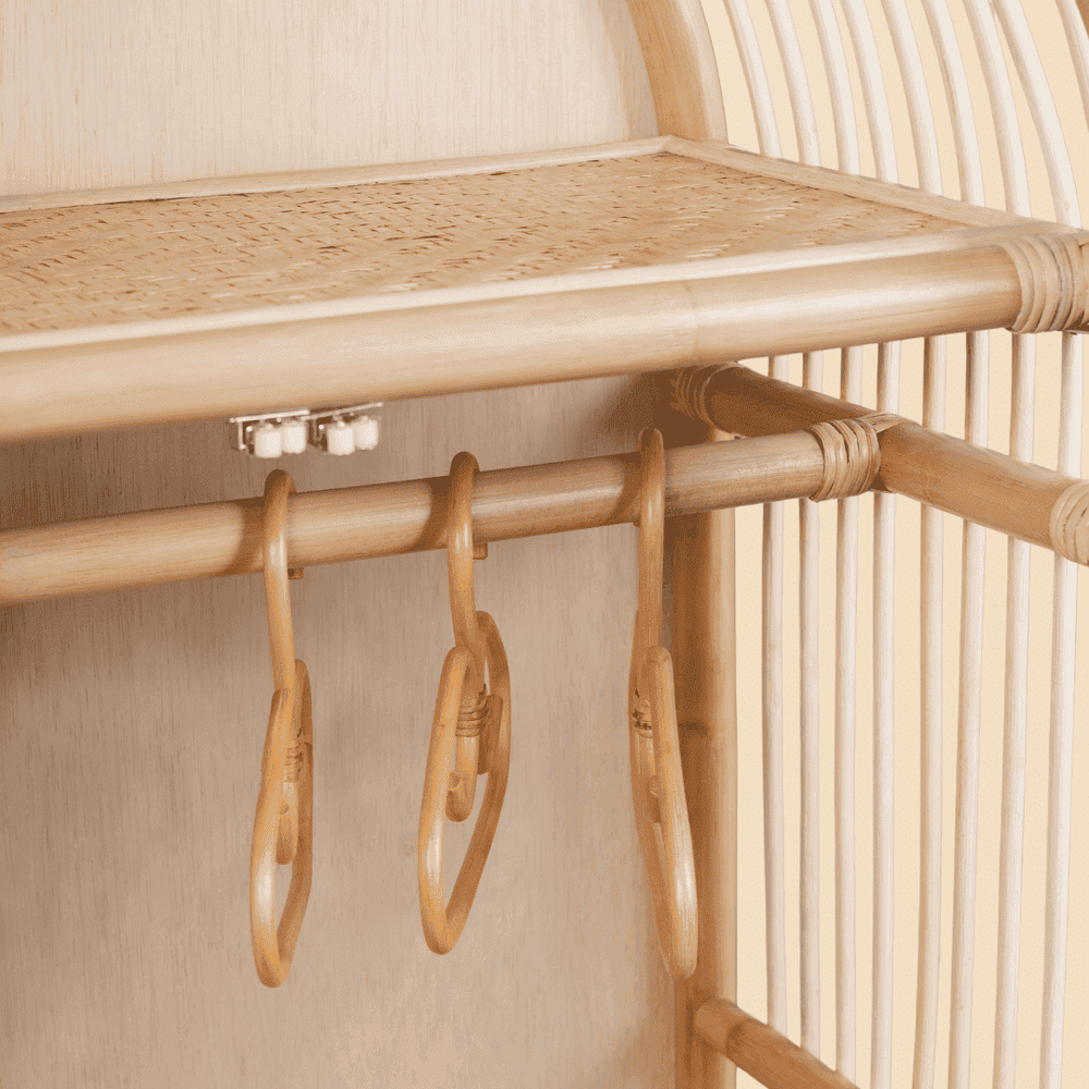 Close-up of the hanging rail inside the Blossom Kids Wardrobe by MOMIJI, designed for storing kids clothing neatly.