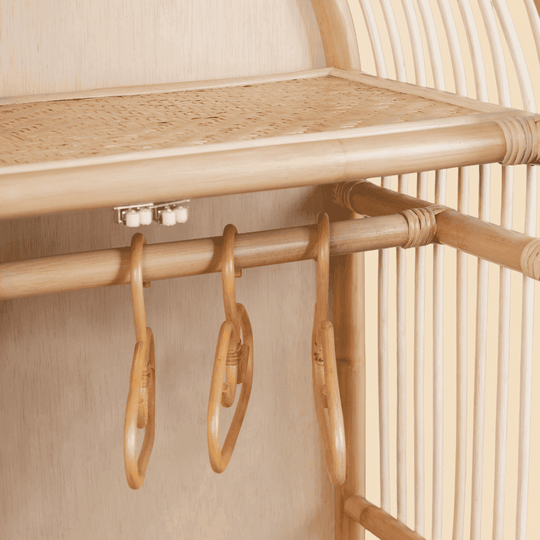 Close-up of the hanging rail inside the Blossom Kids Wardrobe by MOMIJI, designed for storing kids clothing neatly.