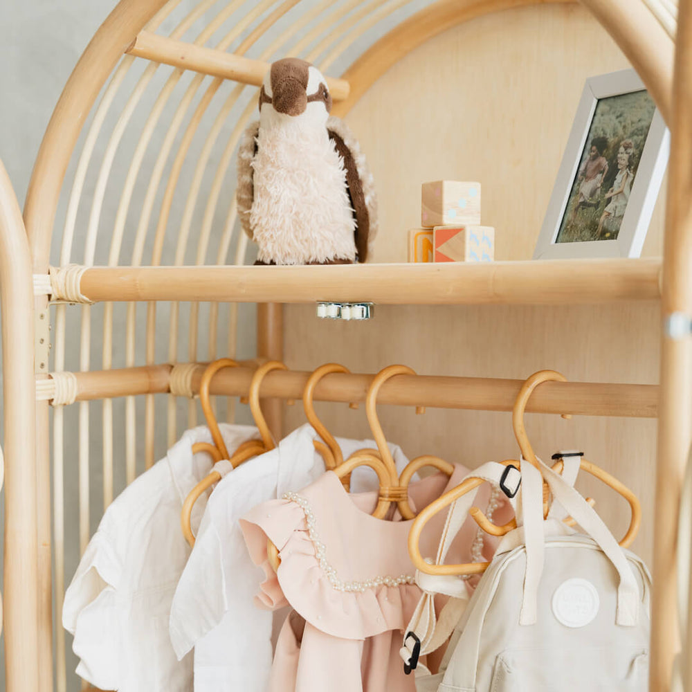 Close-up of the hanging rail and upper storage shelf inside the Blossom Kids Wardrobe by MOMIJI, designed for organizing kids clothes and toys.