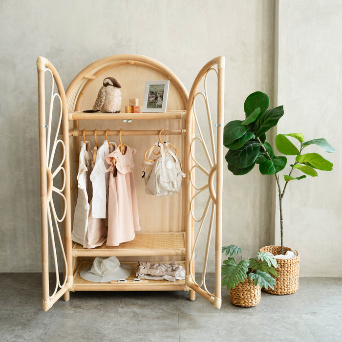 Handcrafted rattan wicker Blossom Kids Wardrobe by MOMIJI with doors open, showing organized children’s clothes and accessories, designed to encourage independence through Montessori-style storage.