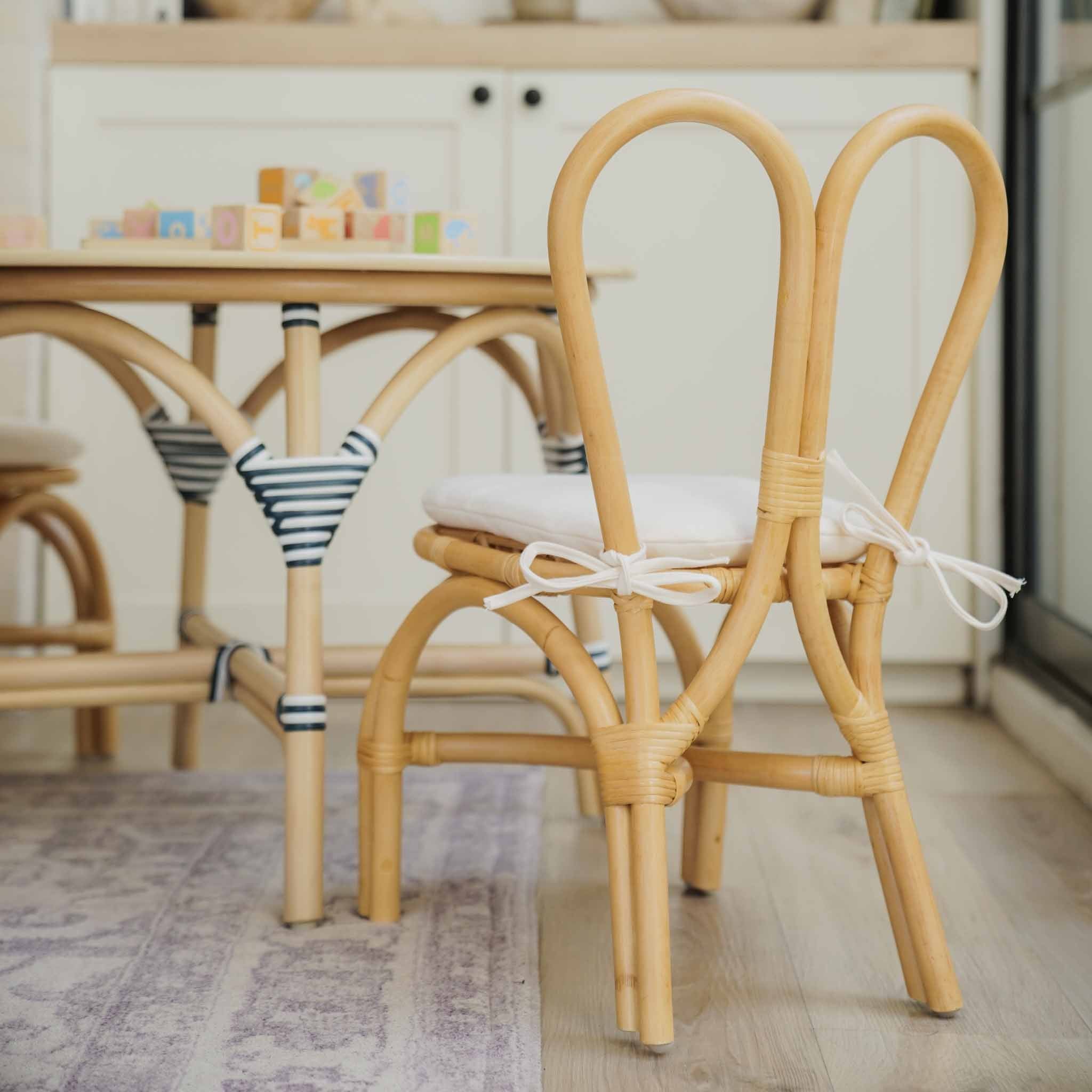 Kids Bunny Chairs (Natural) with removeable white cushions, and signature bunny-ear backrests shown from the back in a bright modern playroom.