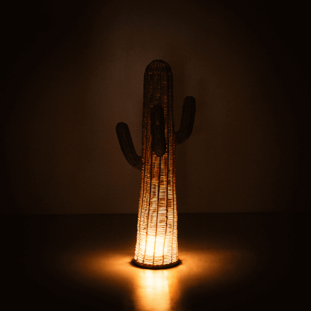 Cactus Kids Coat Light Stand by MOMIJI glowing with warm light against a dark background, perfect as a playful night light.