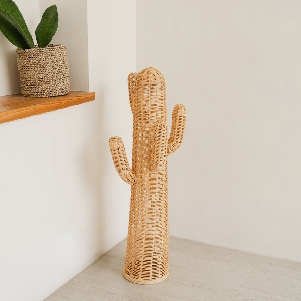 Cactus-shaped rattan kids coat stand with warm lighting by MOMIJI, placed on the floor in a room with indoor plants.