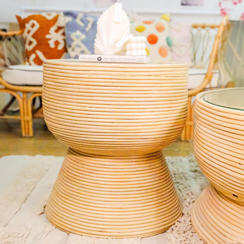 Front view of the Charme Side Table by MOMIJI styled with books and decorative elements.