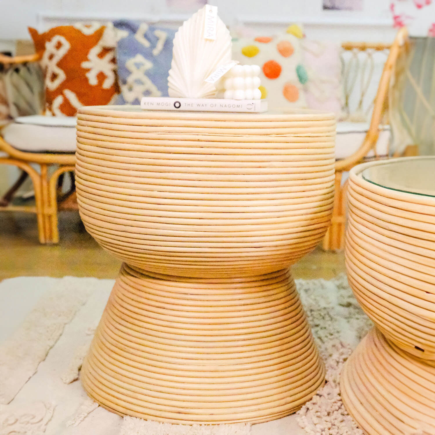 Front view of the Charme Side Table by MOMIJI styled with books and decorative elements.
