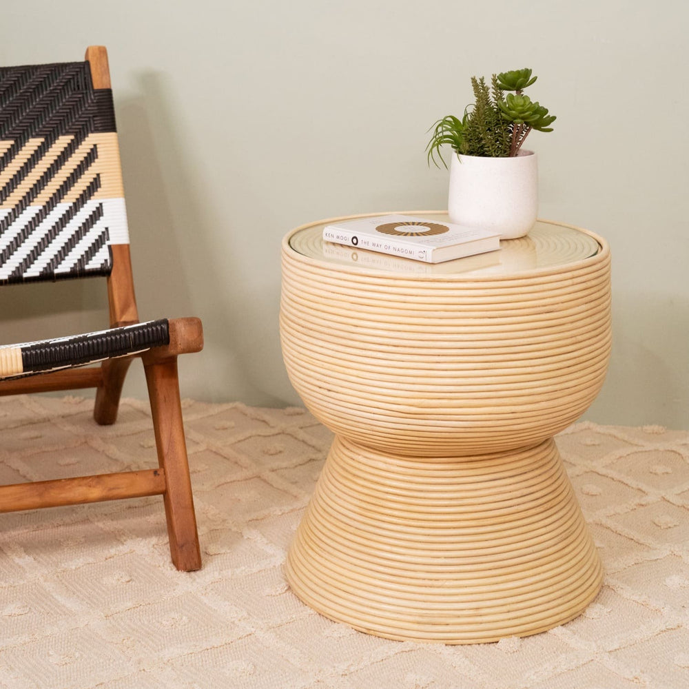 Charme Side Table by MOMIJI styled with books and a vase in a living room.