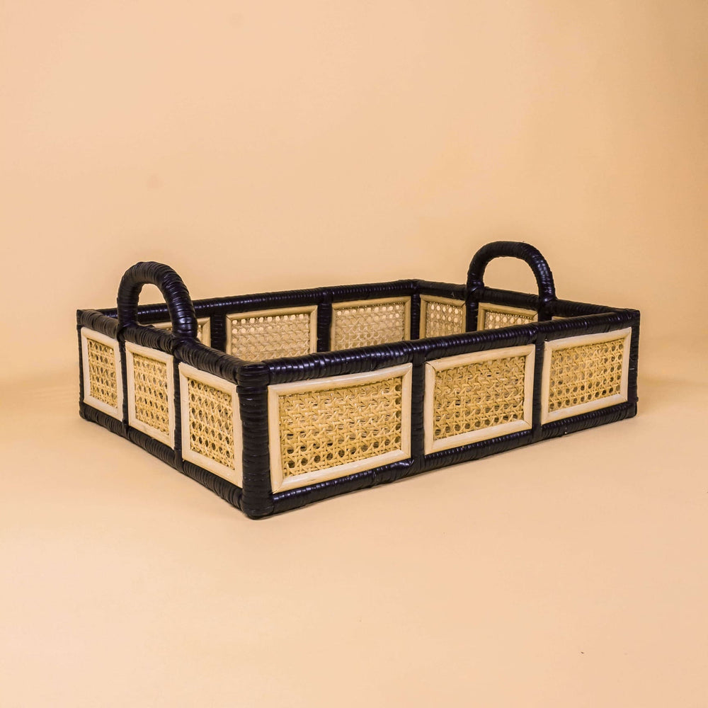 Side view of the Coco Serving Tray by MOMIJI in large size, showcasing the woven rattan edges and base with black rattan framework paired with natural rattan weaving.