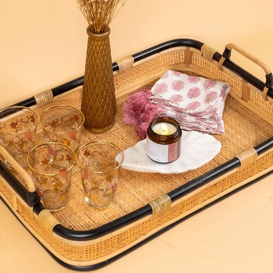 Accessories arranged inside the Coco Serving Tray by MOMIJI in an indoor setting.