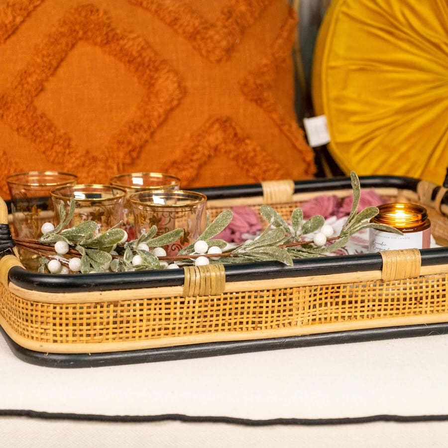 Close-up of the side edge of the Coco Serving Tray by MOMIJI, highlighting its rattan weaving.