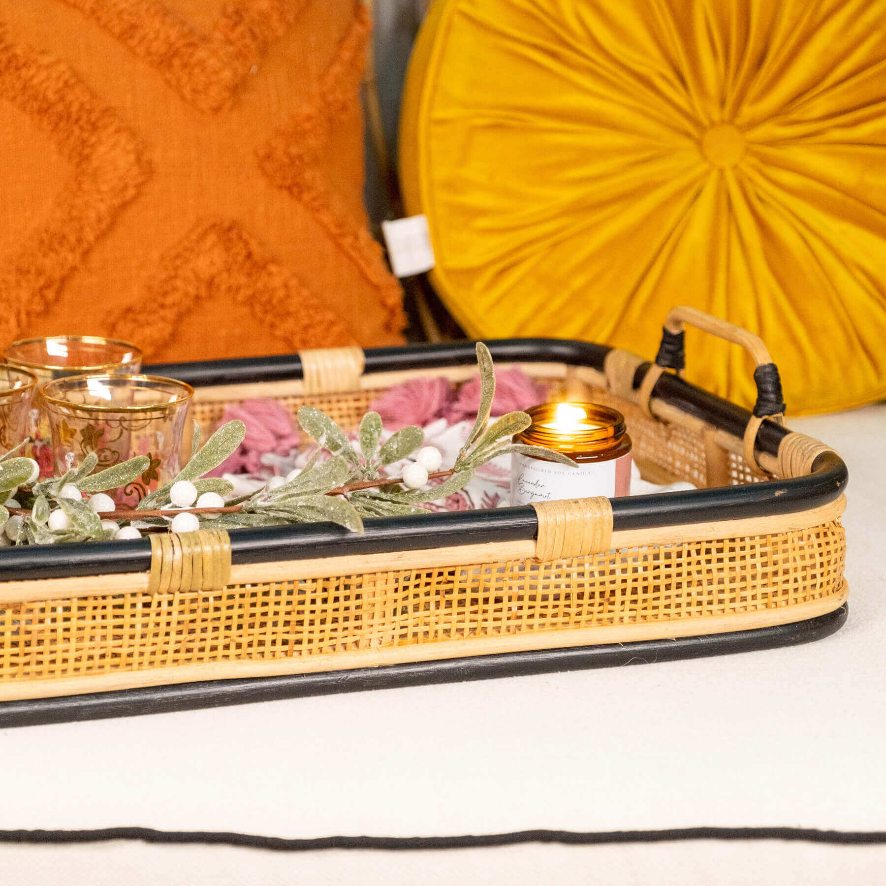 Close-up of the handle and side detail of the Coco Serving Tray by MOMIJI with accessories inside.