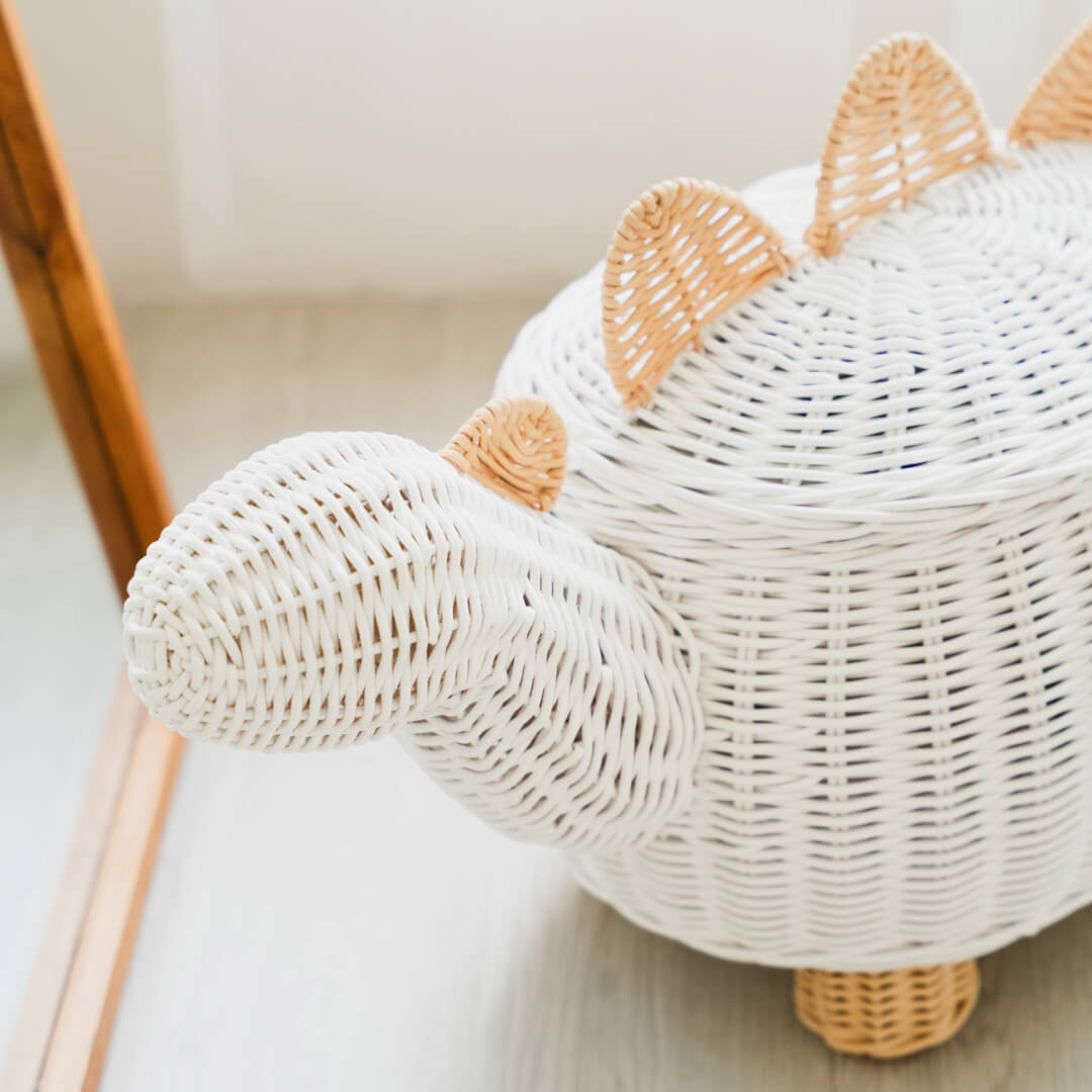 Close up head shot of the white dinosaur rattan storage basket by MOMIJI.