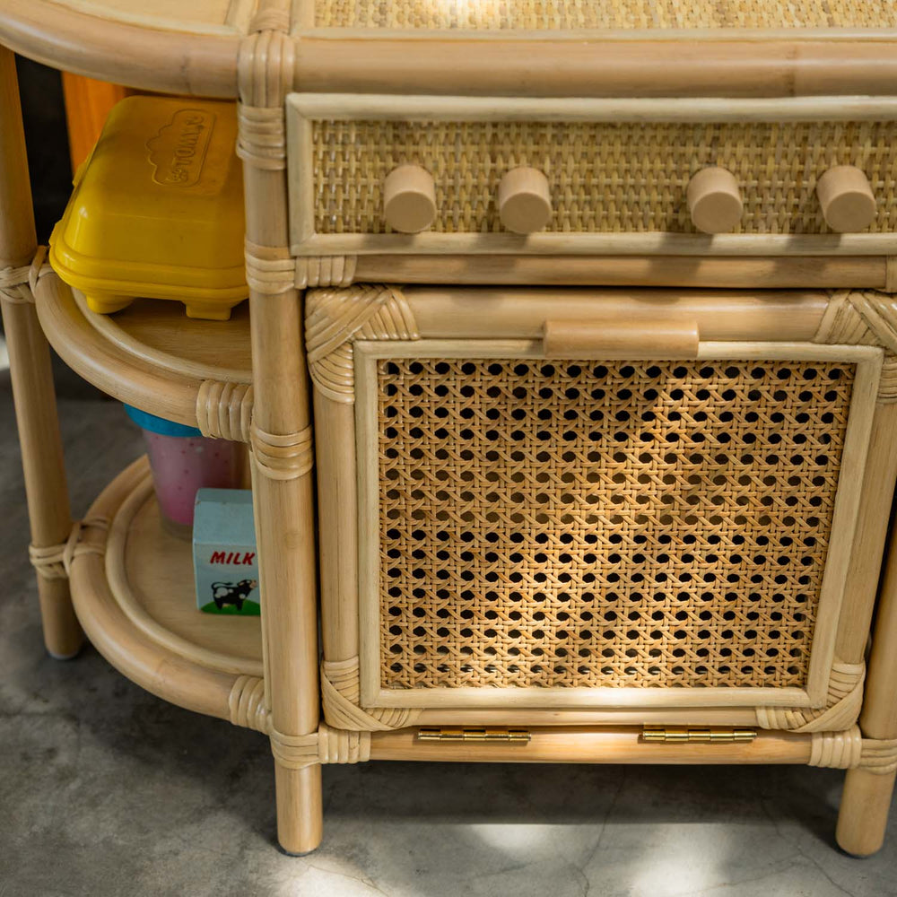 Close-up of the oven area of the Dreamer Play Kitchen by MOMIJI, highlighting its decorative motif.