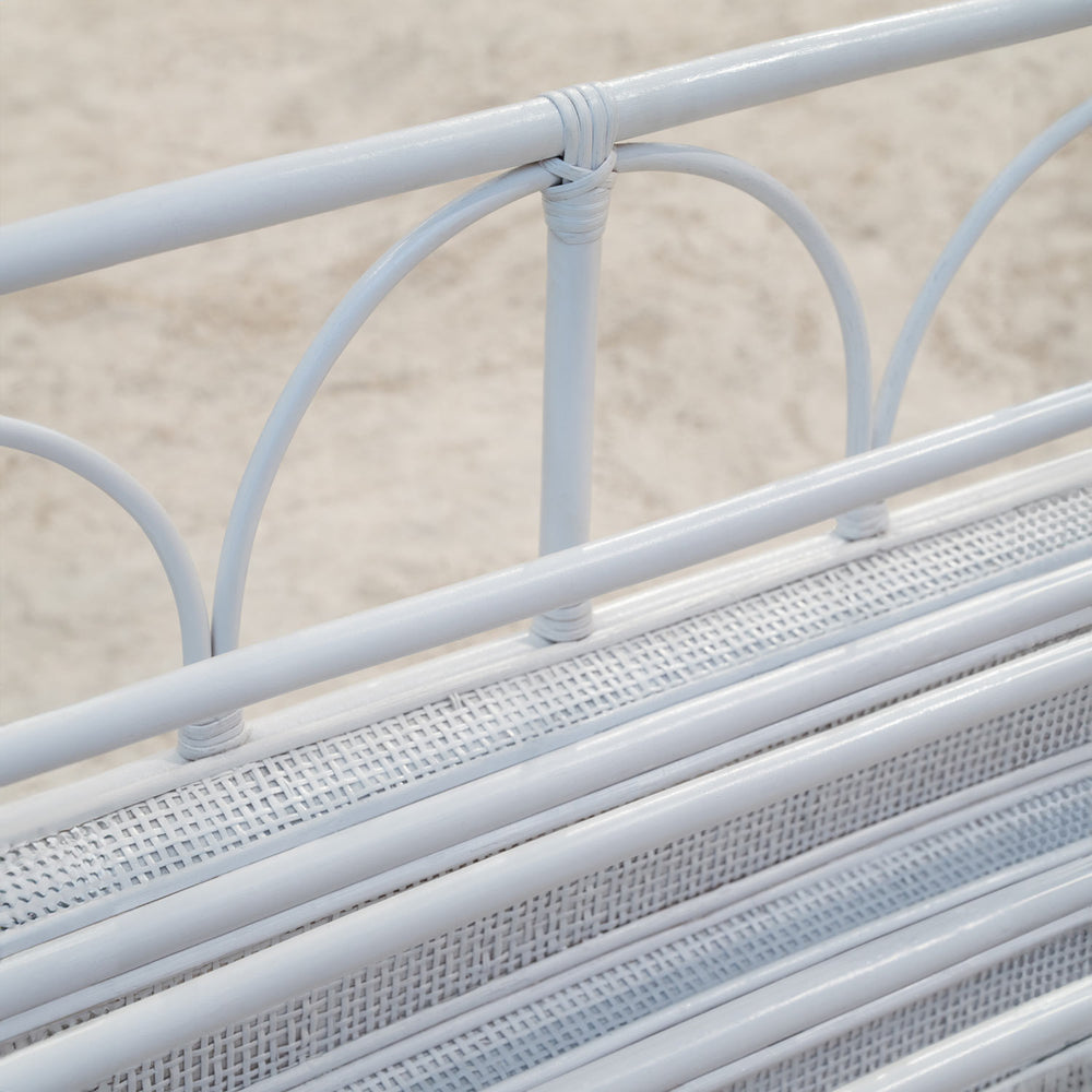 Close-up view of handwoven rattan wicker detailing on Elena Montessori Kids Bookshelf – White by MOMIJI.