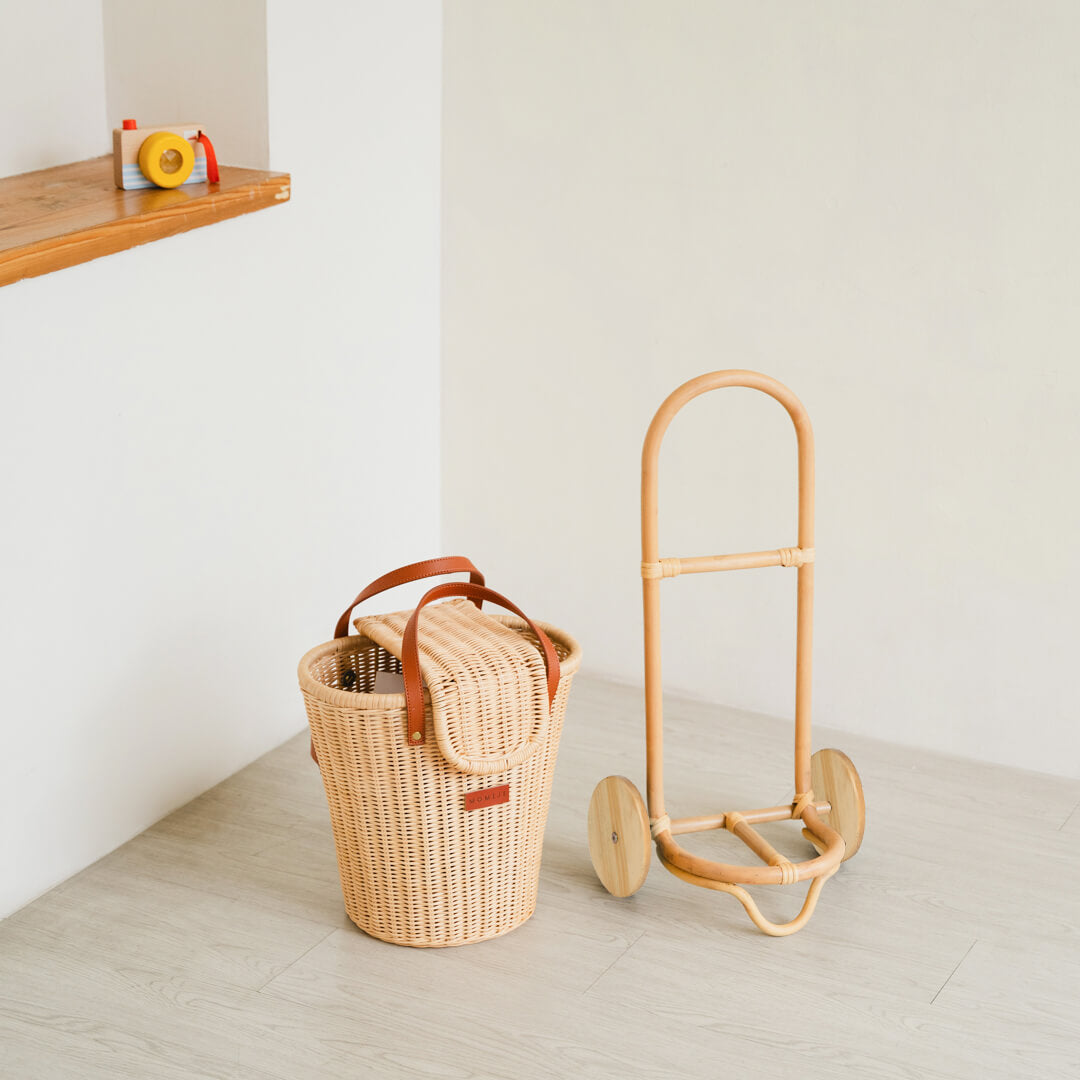 The Eric Kids Shopping Trolley by MOMIJI displayed with its detachable shopping bag in decorative room.