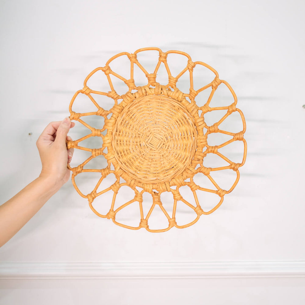 Front view of the Floral placemat by MOMIJI held against a white wall background.