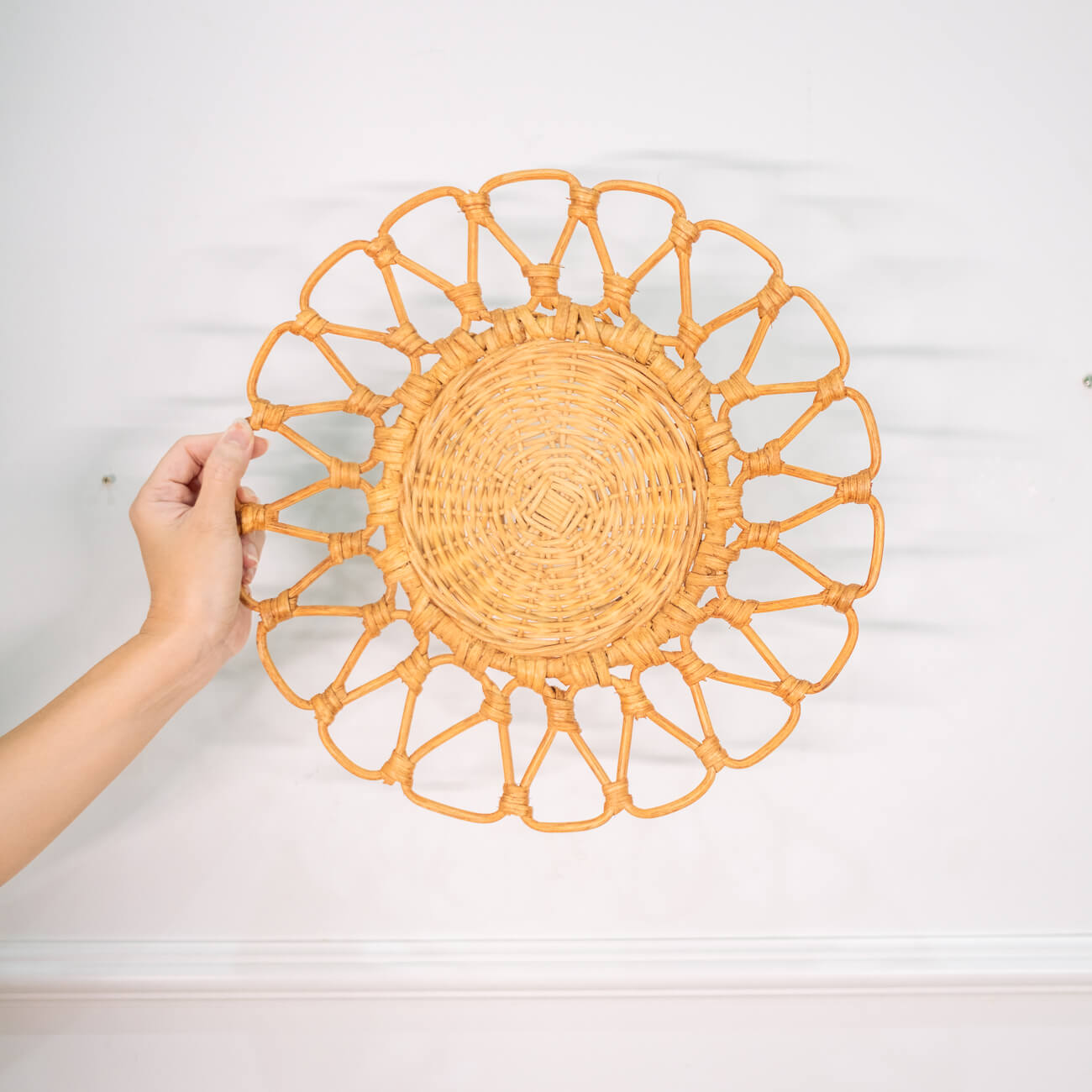 Front view of the Floral placemat by MOMIJI held against a white wall background.