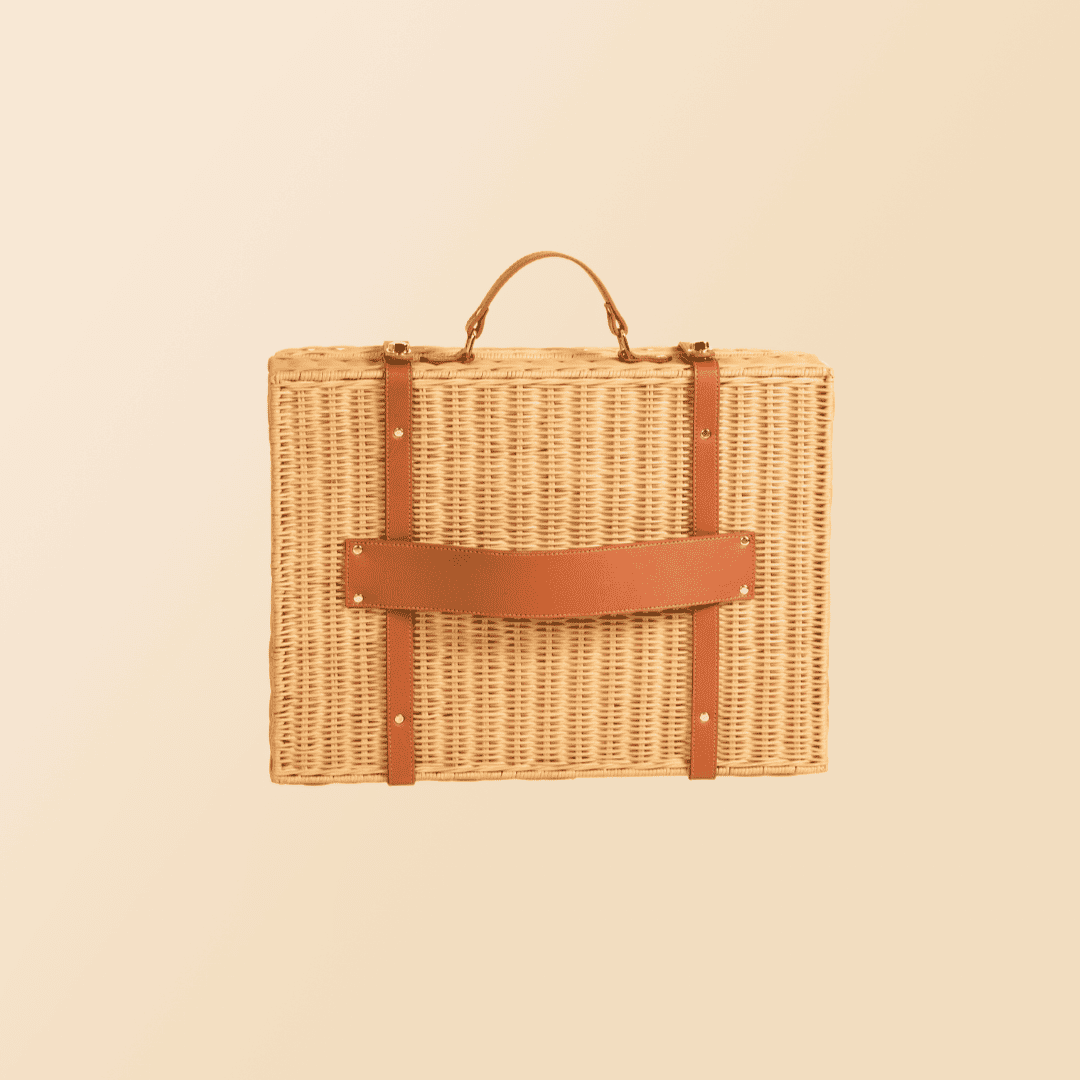 Back view of the handcrafted rattan and wicker Jasmine Suitcase by MOMIJI in natural color, featuring attachment straps and integrated handle.