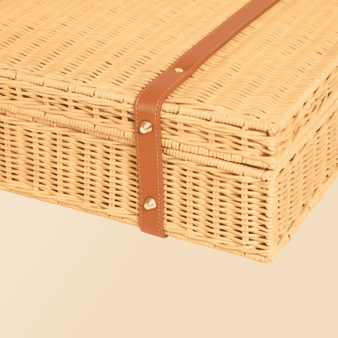 Bottom view of the natural version of Jasmine  rattan Suitcase by MOMIJI showing its base structure.